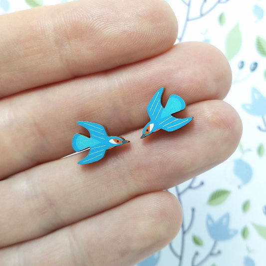 Wooden kingfisher stud earrings held on hand