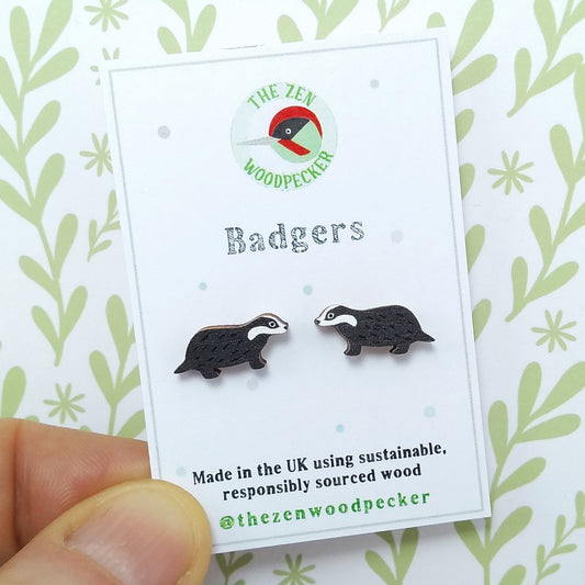 Wooden badger stud earrings on display card