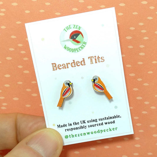 Wooden bearded tit stud earrings on display card