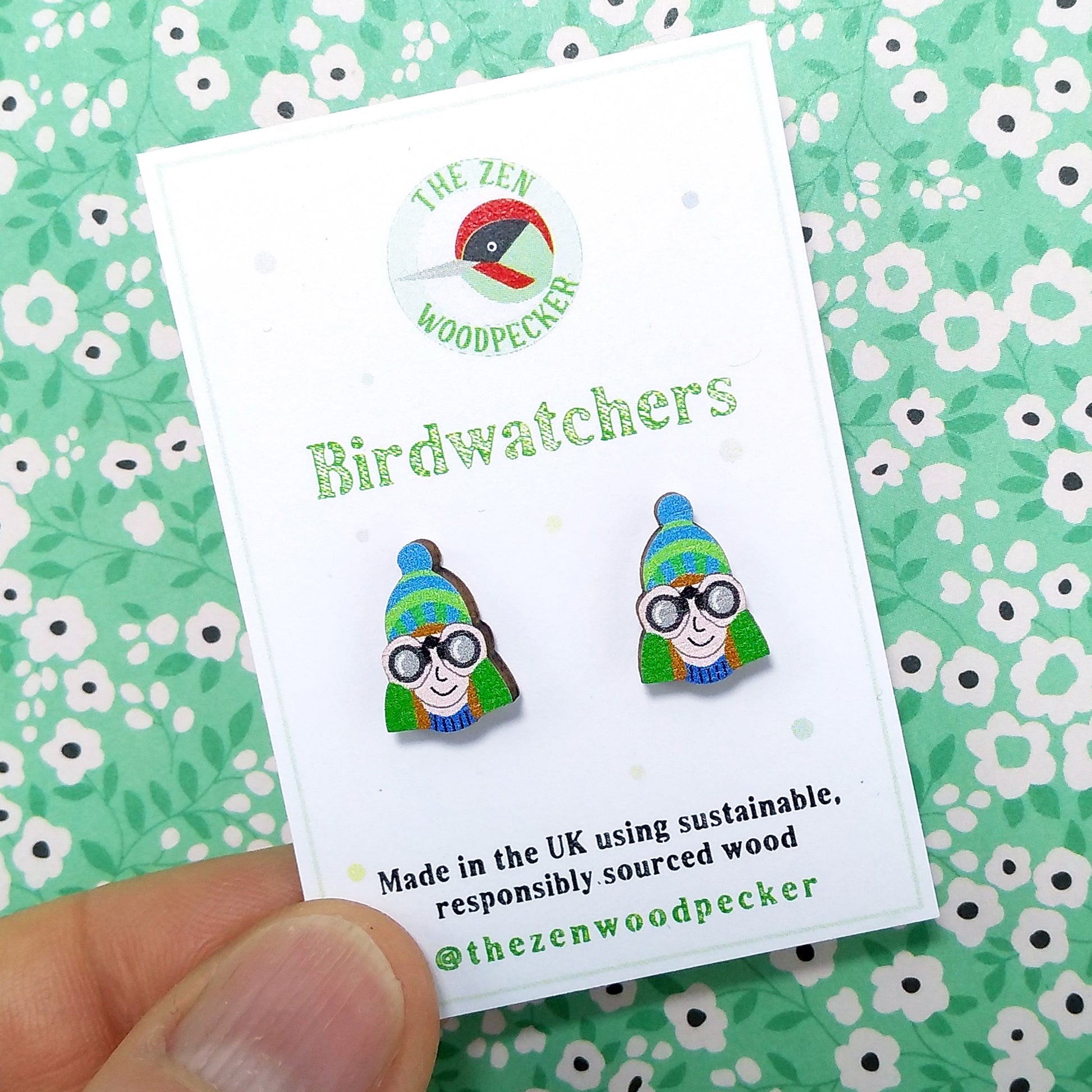 Wooden birdwatcher stud earrings on display card