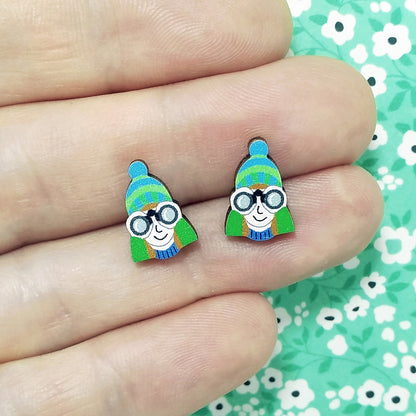 Wooden birdwatcher stud earrings held on hand
