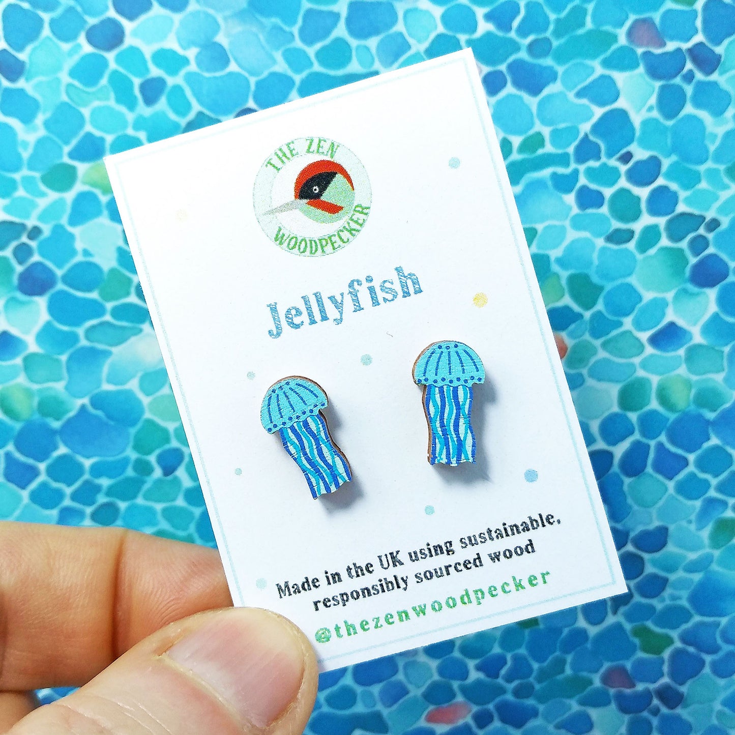 Wooden blue jellyfish stud earrings on display card