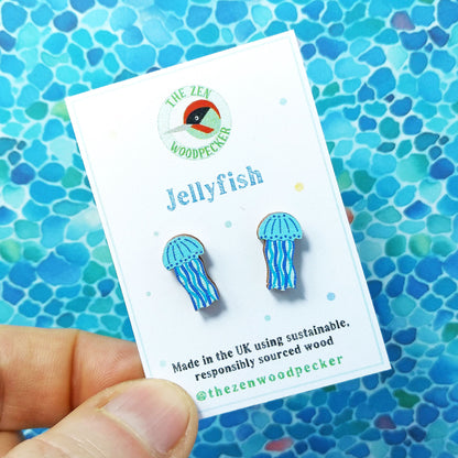 Wooden blue jellyfish stud earrings on display card