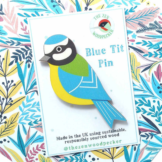Wooden blue tit pin badge on display card