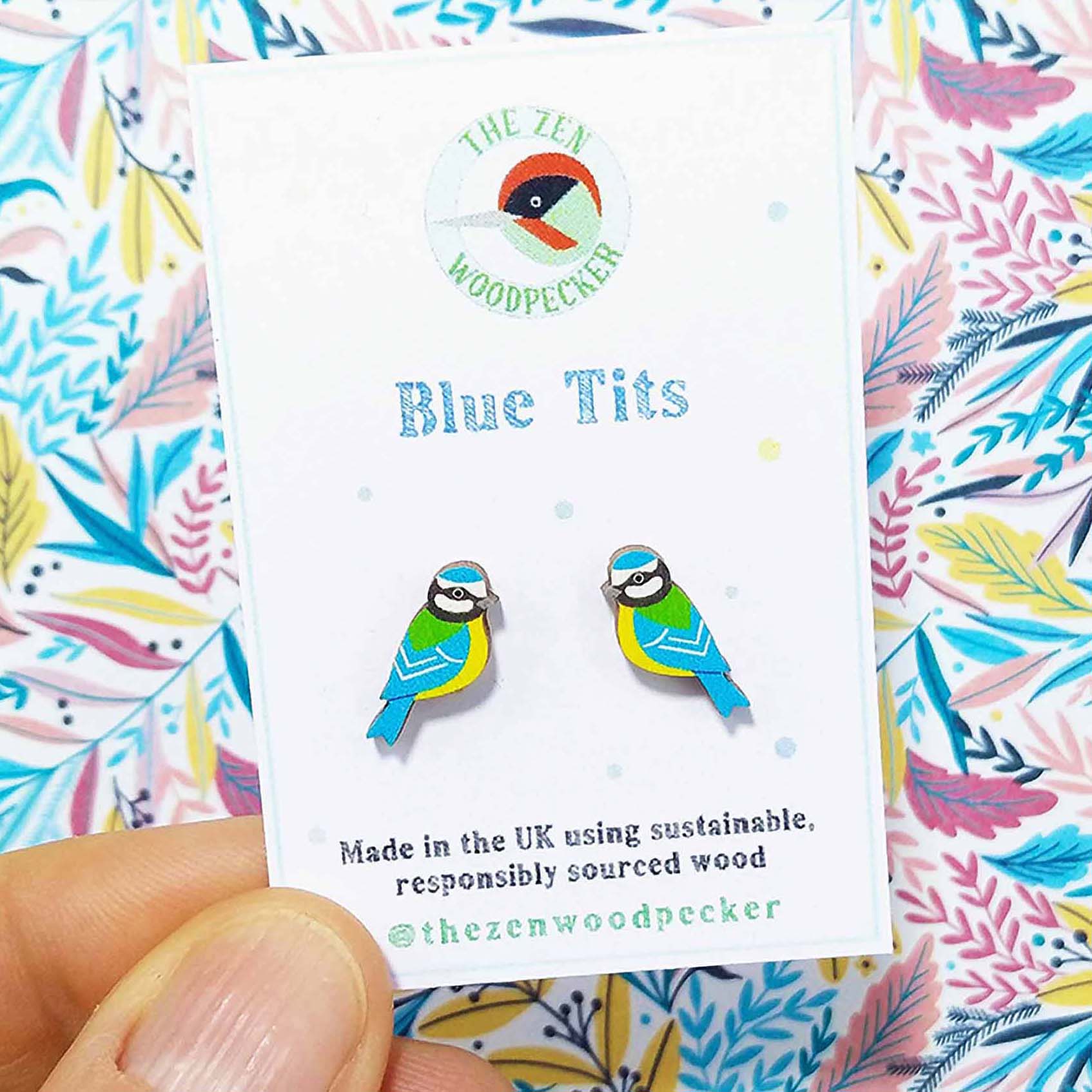 Wooden blue tit stud earrings on display card