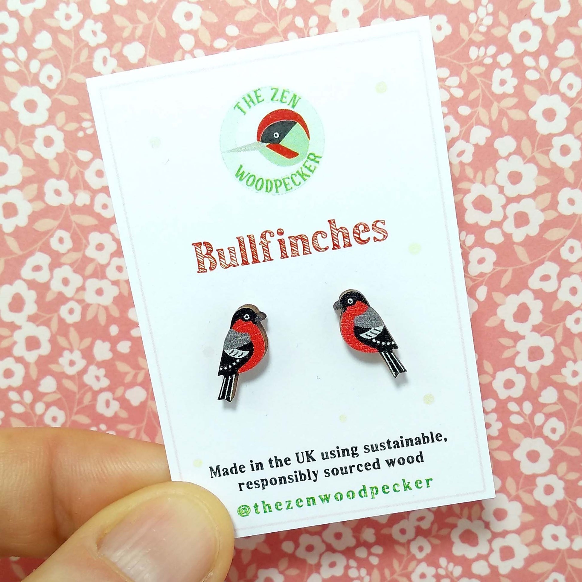 Wooden bullfinch stud earrings on display card