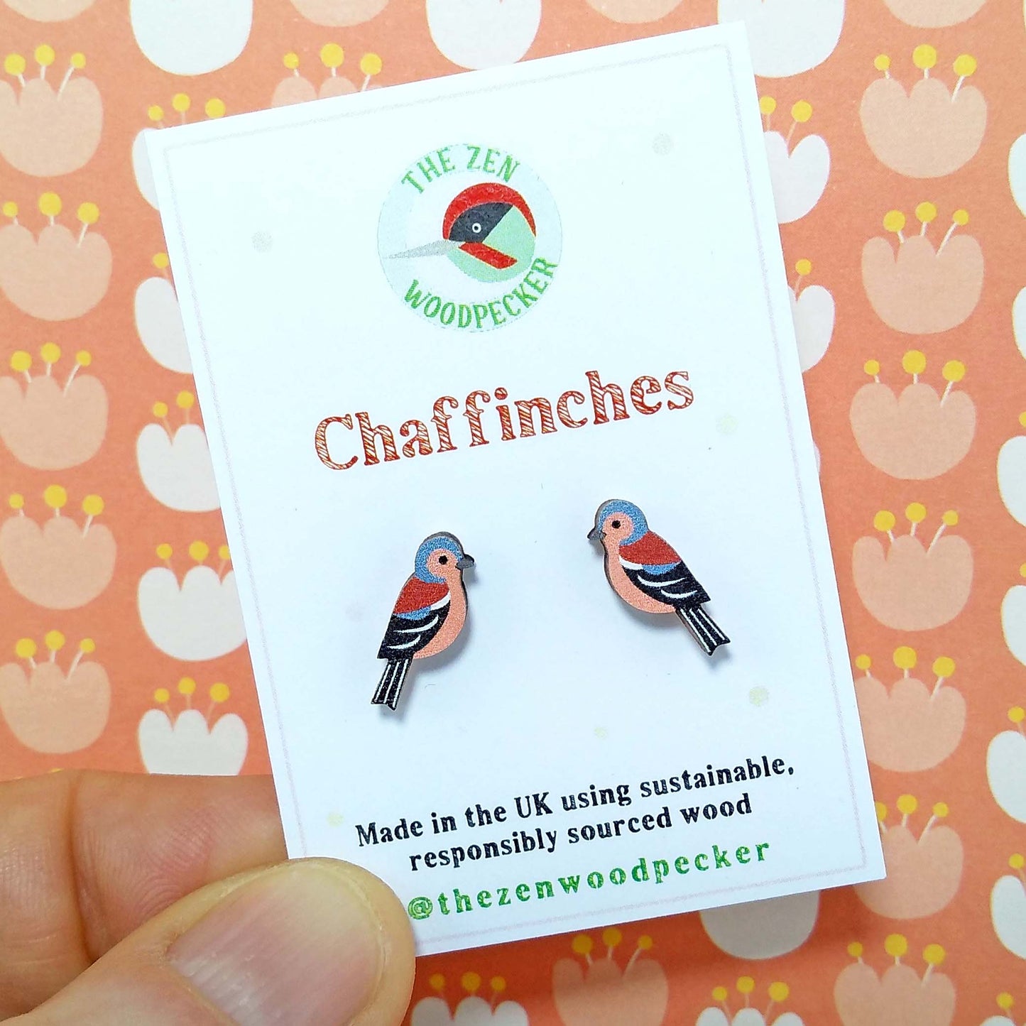 Wooden chaffinch stud earrings on display card