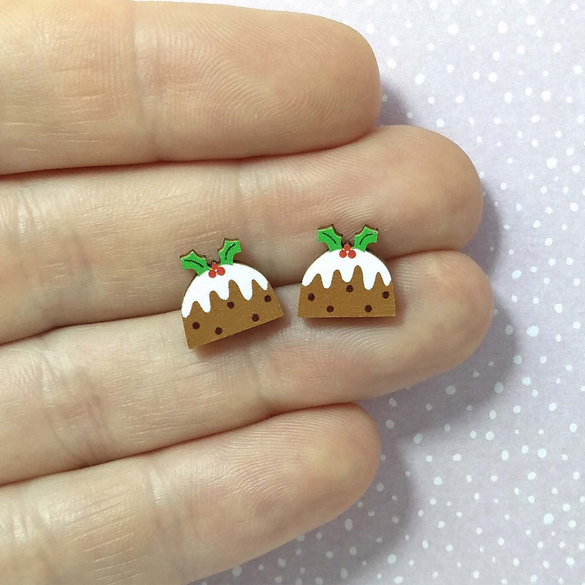 Christmas pudding wooden stud earrings held on hand