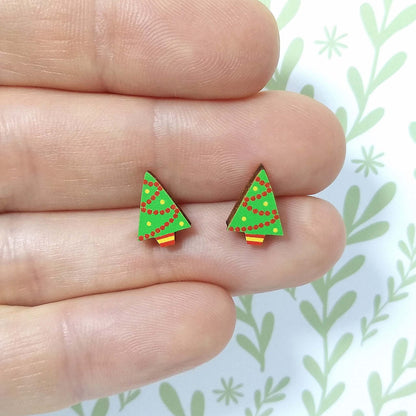 Christmas tree wooden stud earrings held on hand