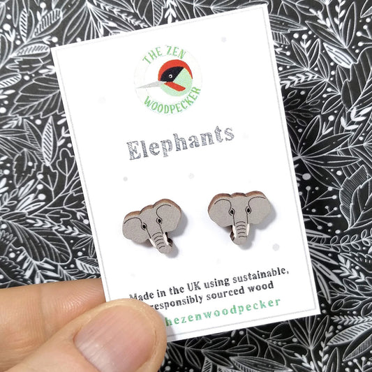 Wooden elephant stud earrings on display card