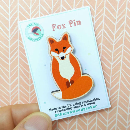Wooden fox pin badge on display card