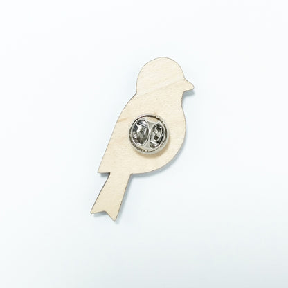 Back of goldfinch pin badge showing metal butterfly clutch pin