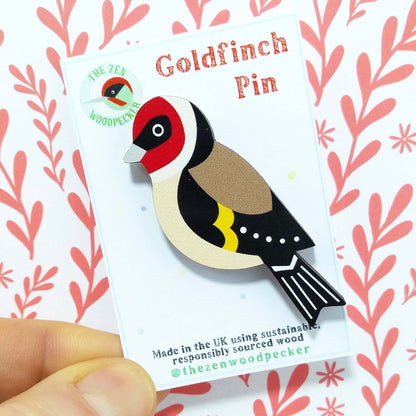 Wooden goldfinch pin badge on display card