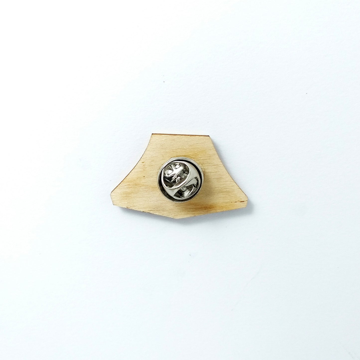 Back of green tent pin badge showing metal butterfly clutch pin