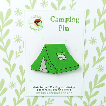 Wooden green tent pin badge on display card