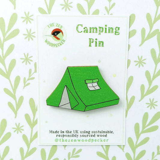 Wooden green tent pin badge on display card