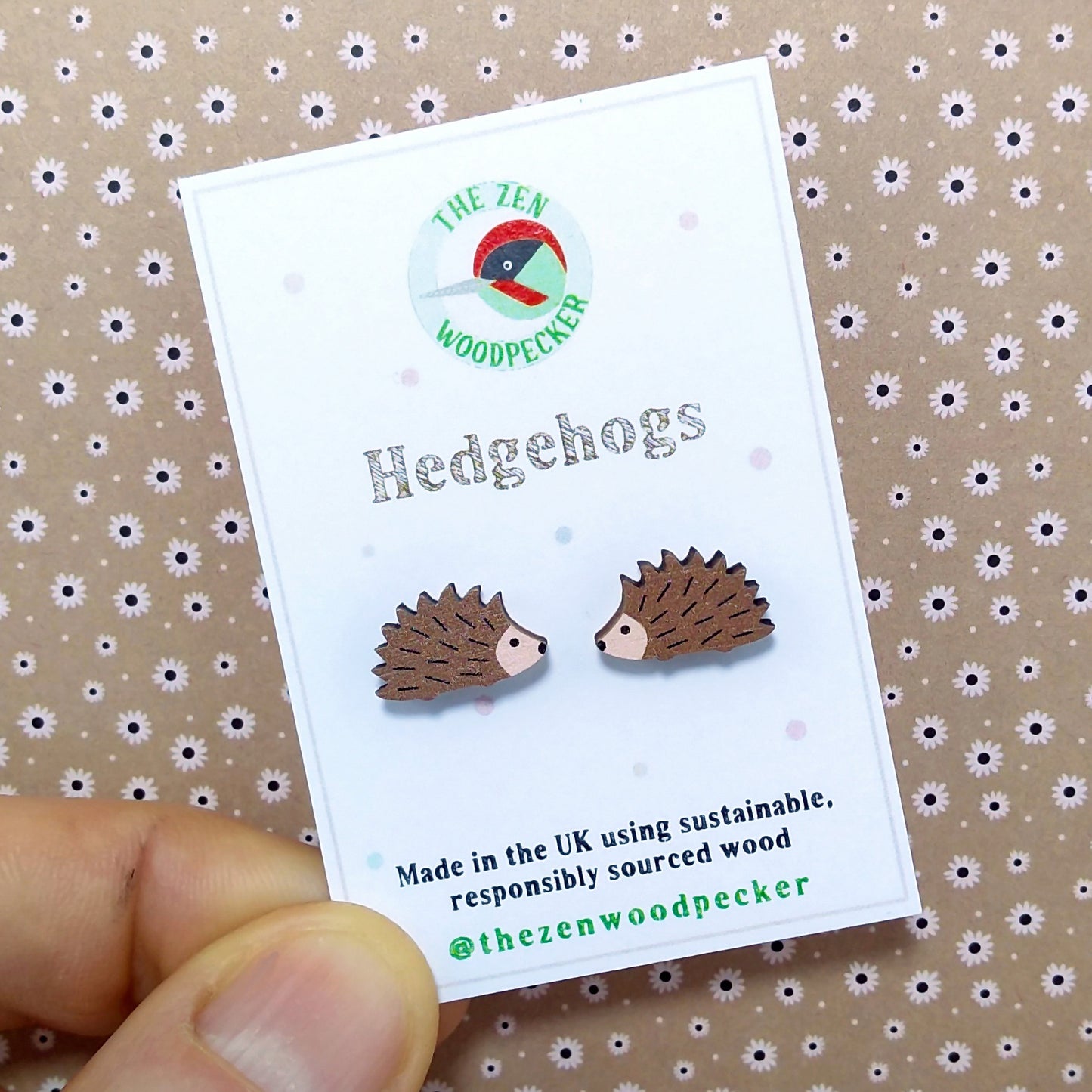Wooden hedgehog stud earrings on display card