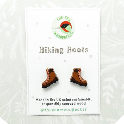 Wooden hiking boot stud earrings on display card