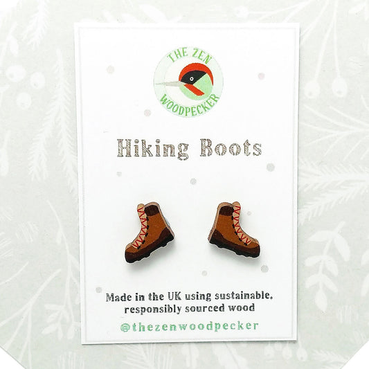 Wooden hiking boot stud earrings on display card