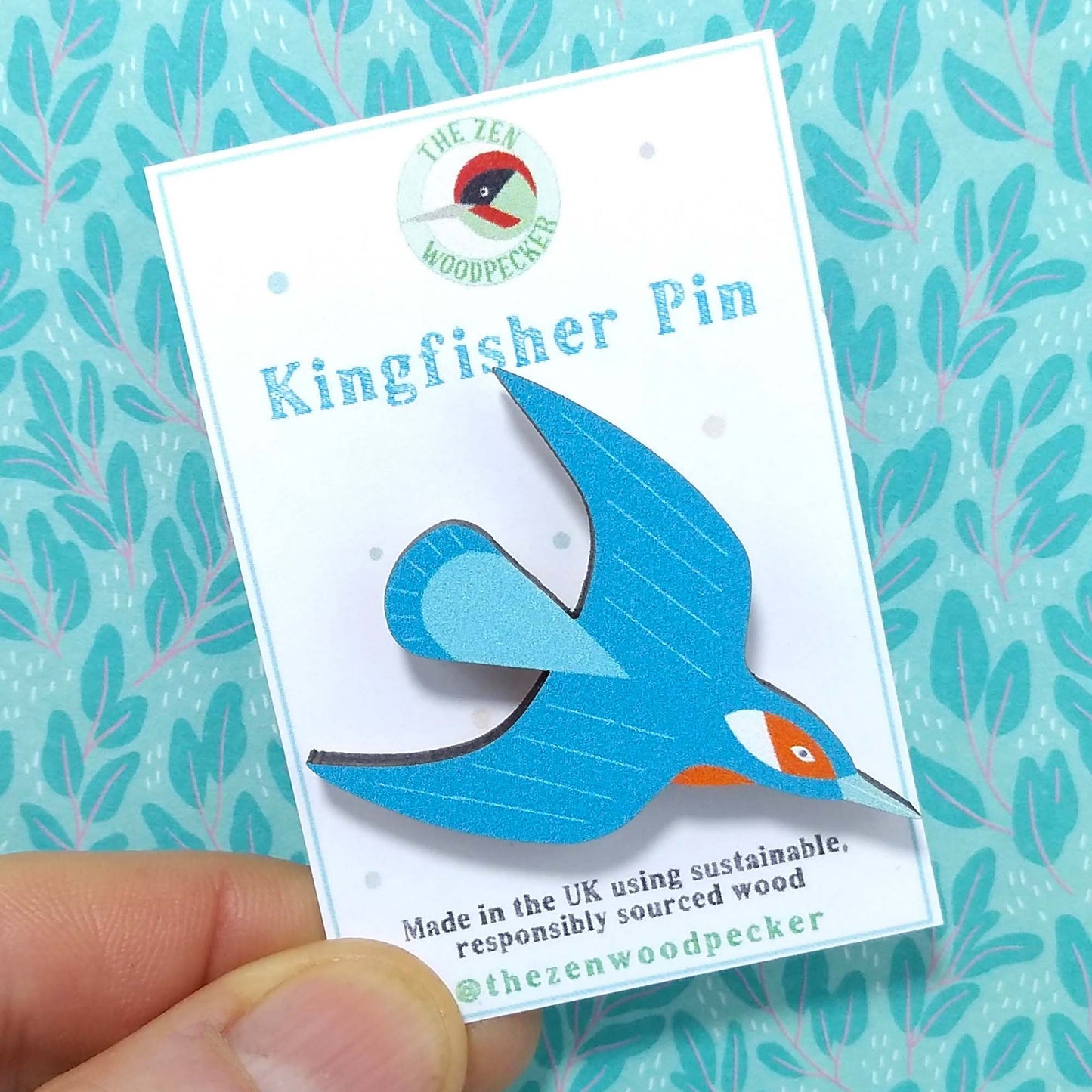 Wooden kingfisher pin badge on display card