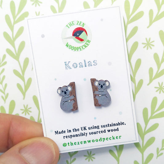 Wooden koala stud earrings on display card