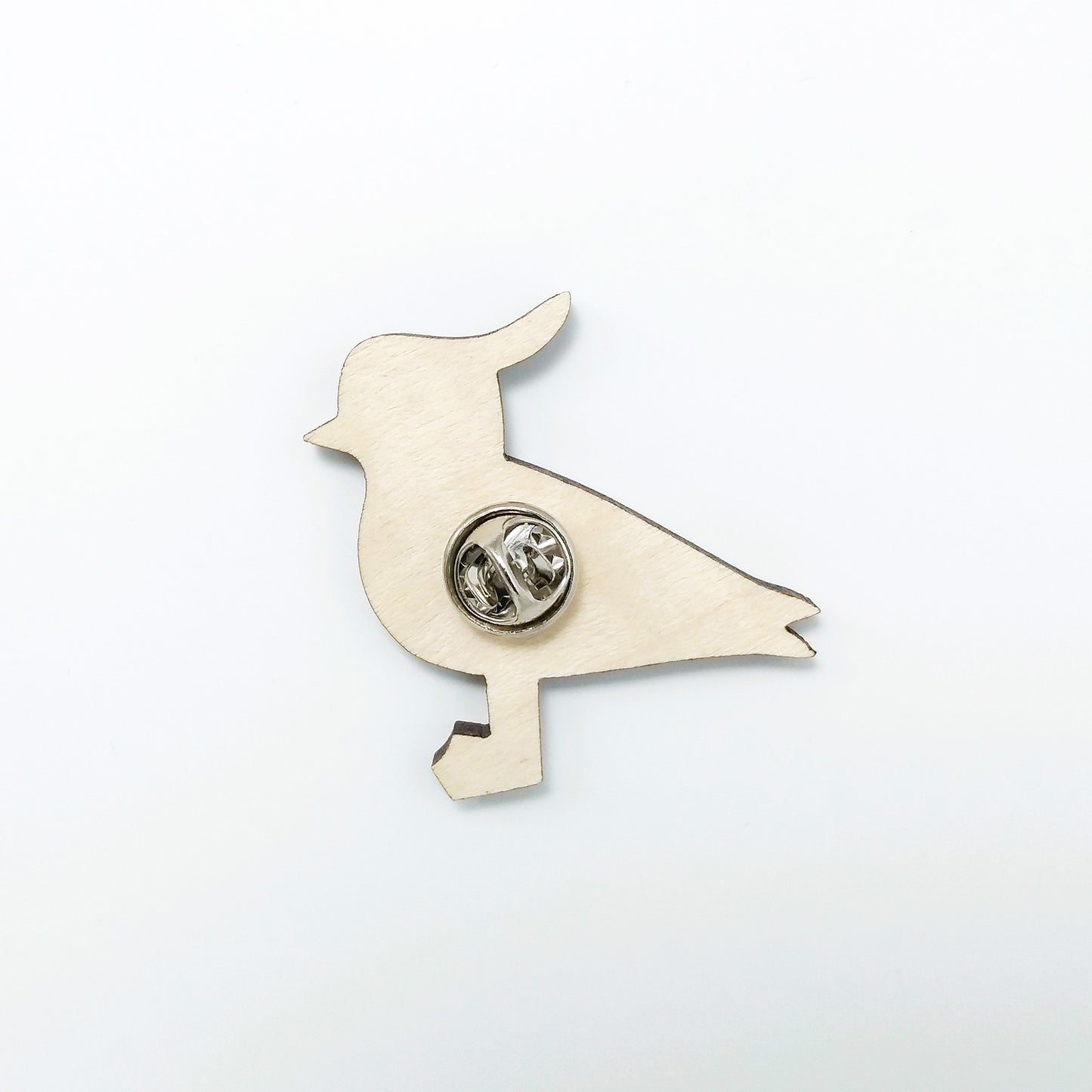 Back of lapwing pin badge showing metal butterfly clutch pin