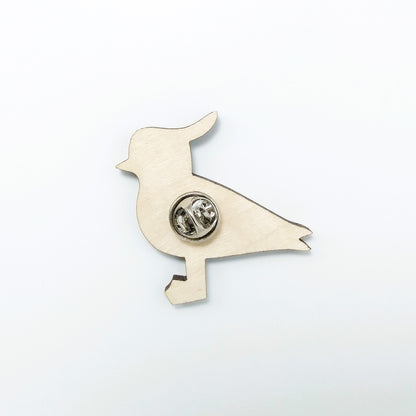 Back of lapwing pin badge showing metal butterfly clutch pin