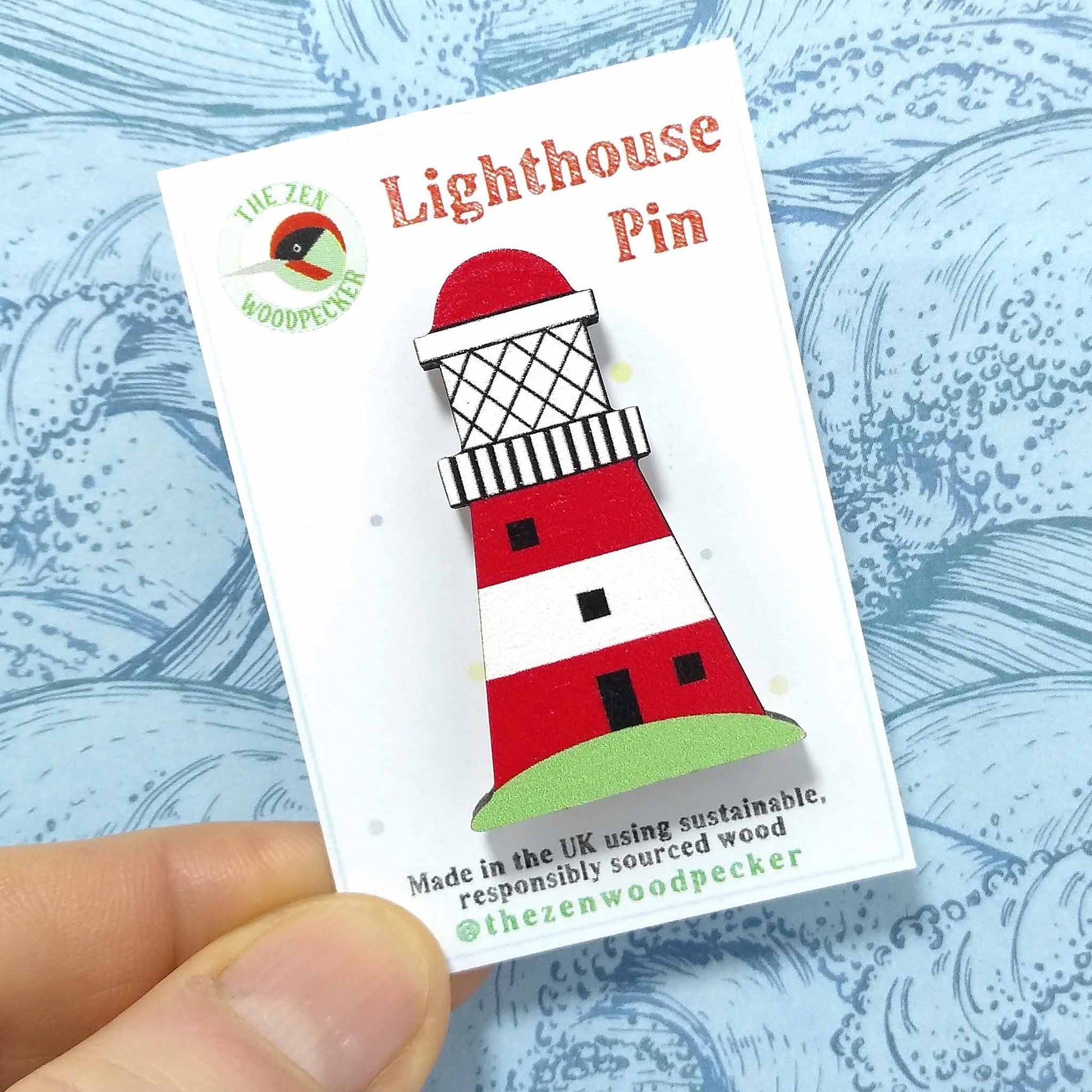 Wooden lighthouse pin badge on display card
