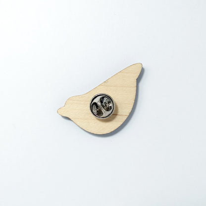 Back of nuthatch pin badge showing metal butterfly clutch pin