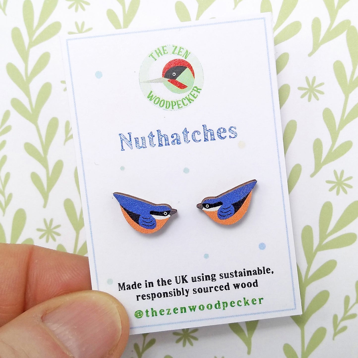 Wooden nuthatch stud earrings on display card