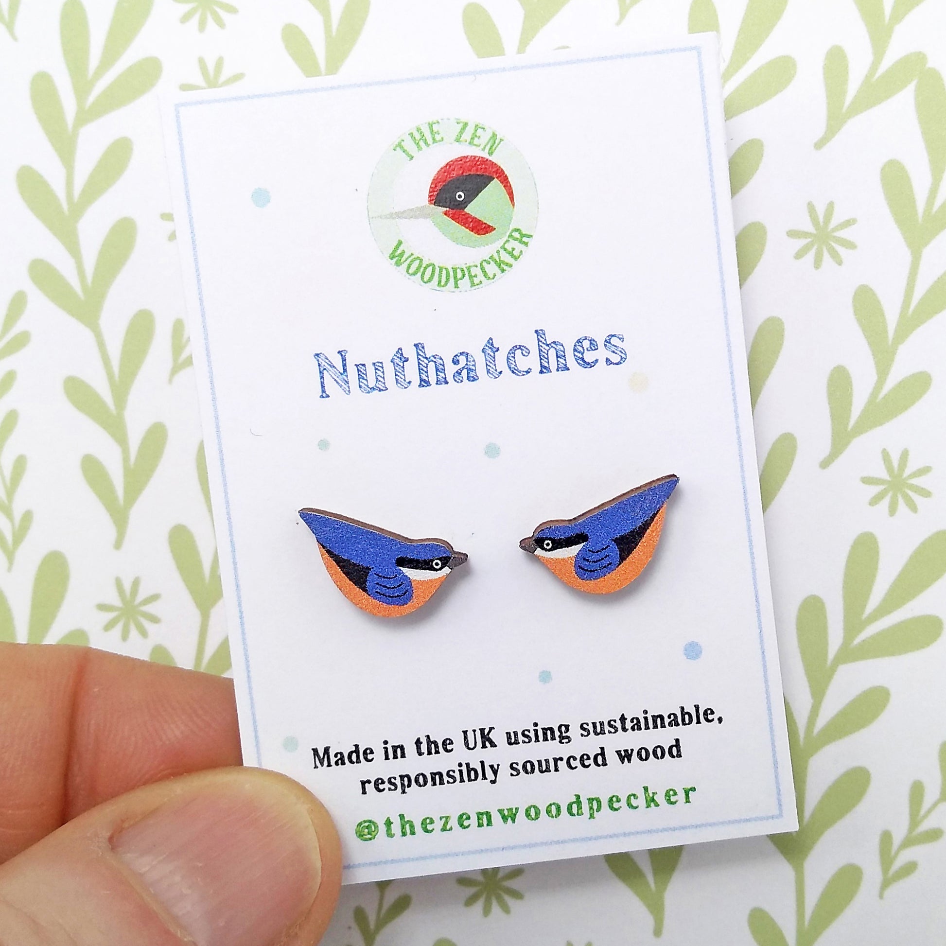 Wooden nuthatch stud earrings on display card