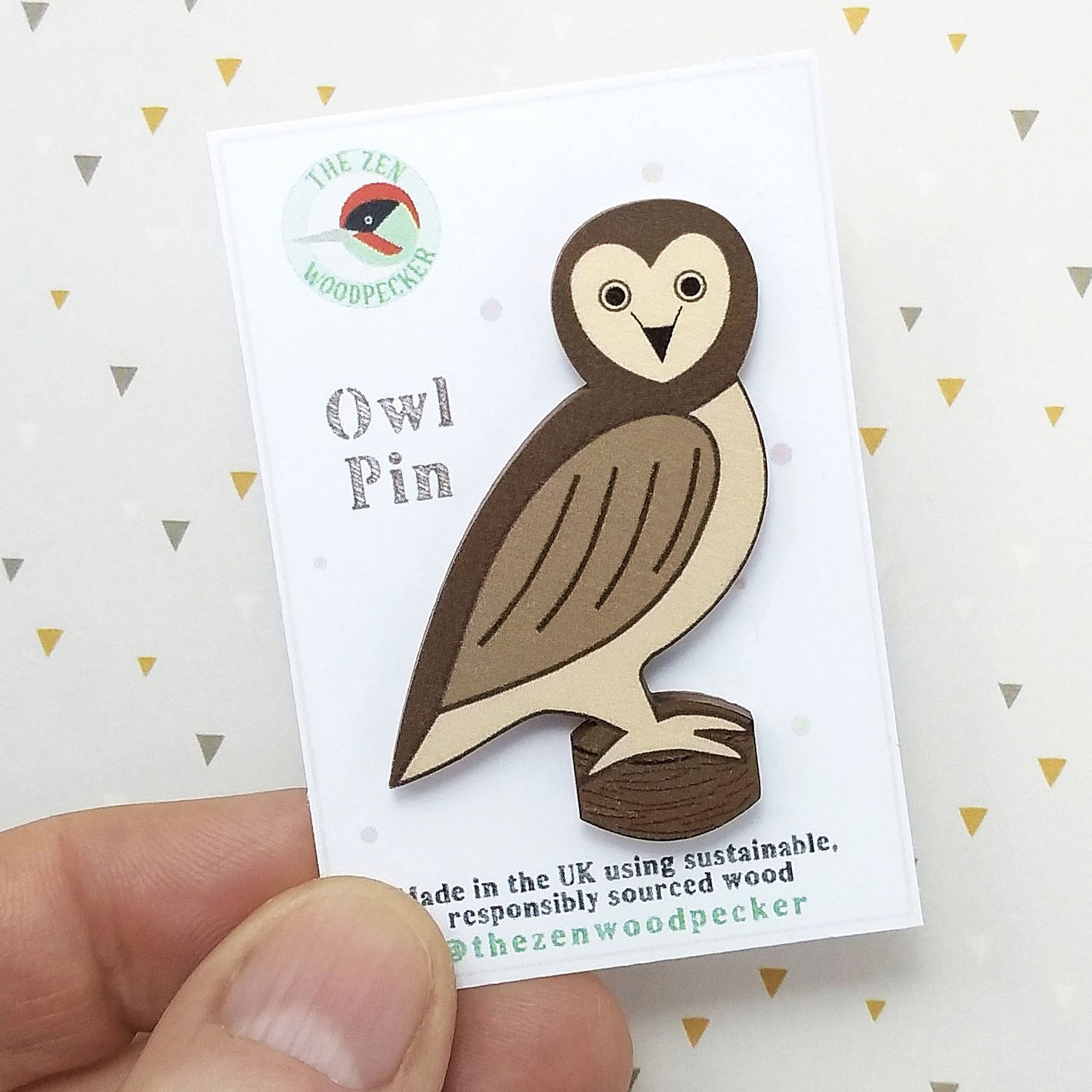 Wooden owl pin badge on display card