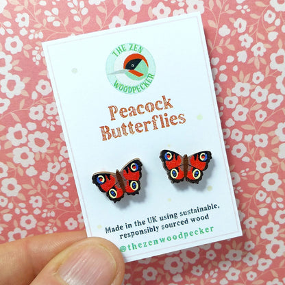 Wooden peacock butterfly stud earrings on display card