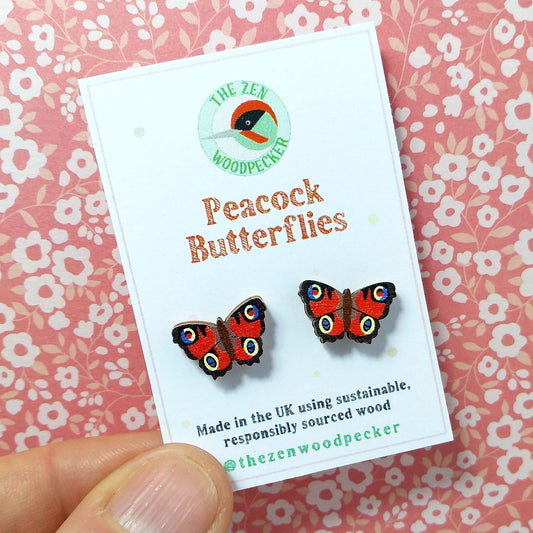 Wooden peacock butterfly stud earrings on display card
