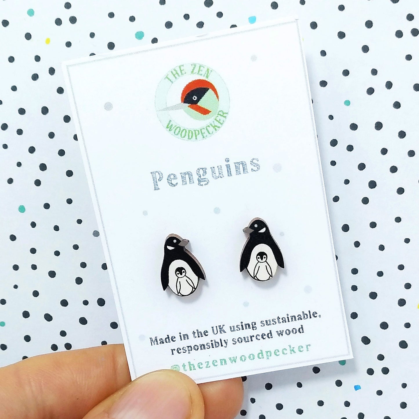 Wooden penguin with chick stud earrings on display card