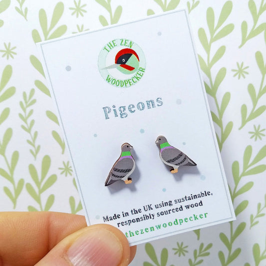 Wooden pigeon stud earrings on display card