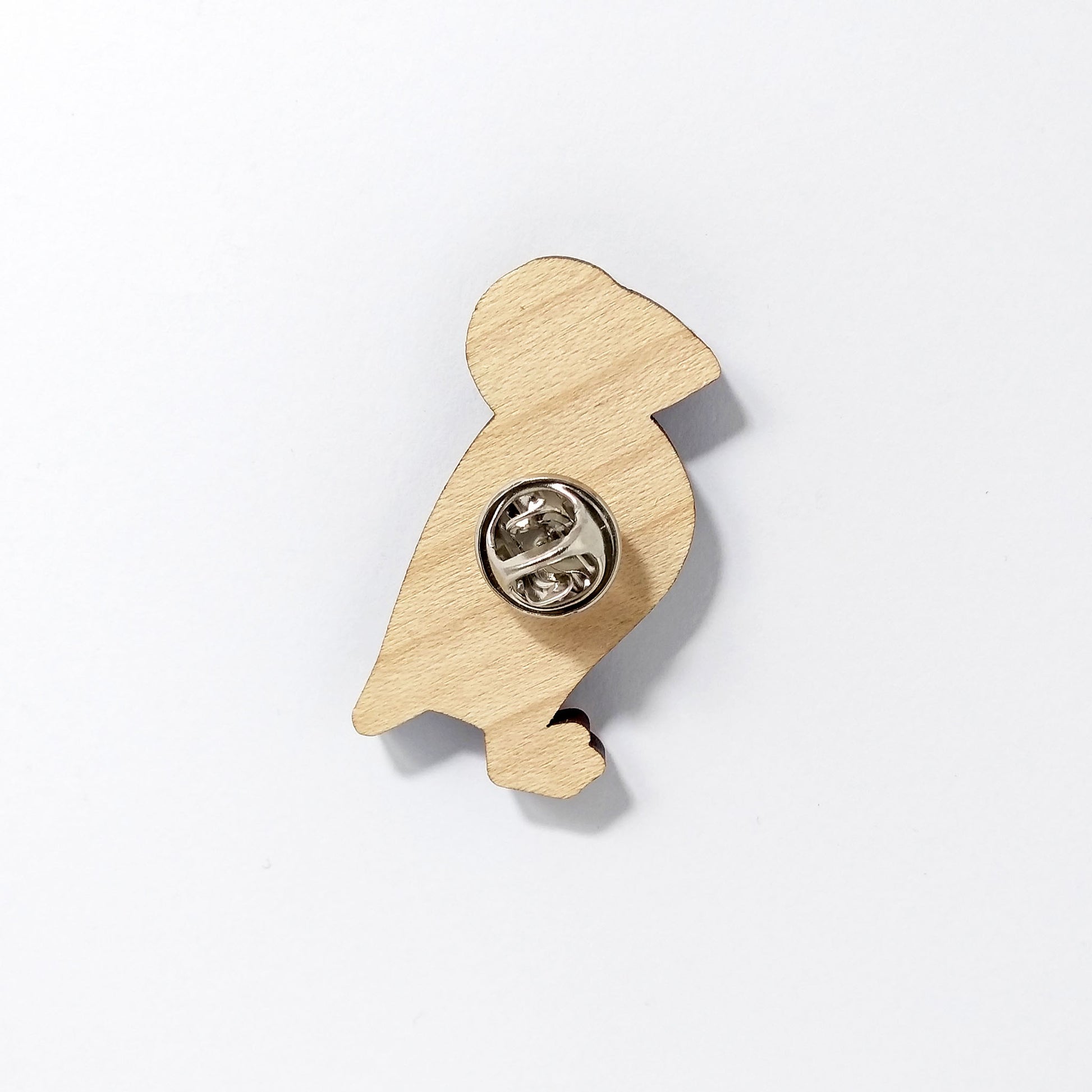 Back of puffin pin badge showing metal butterfly clutch pin