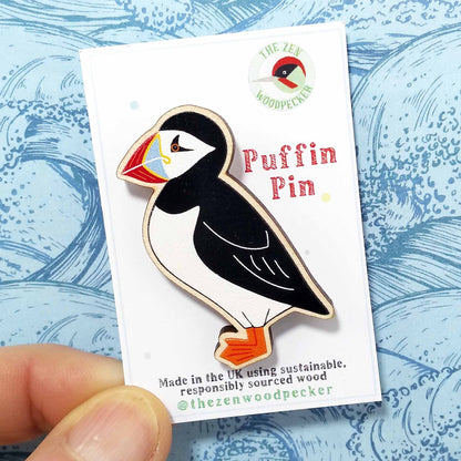 Wooden puffin pin badge on display card