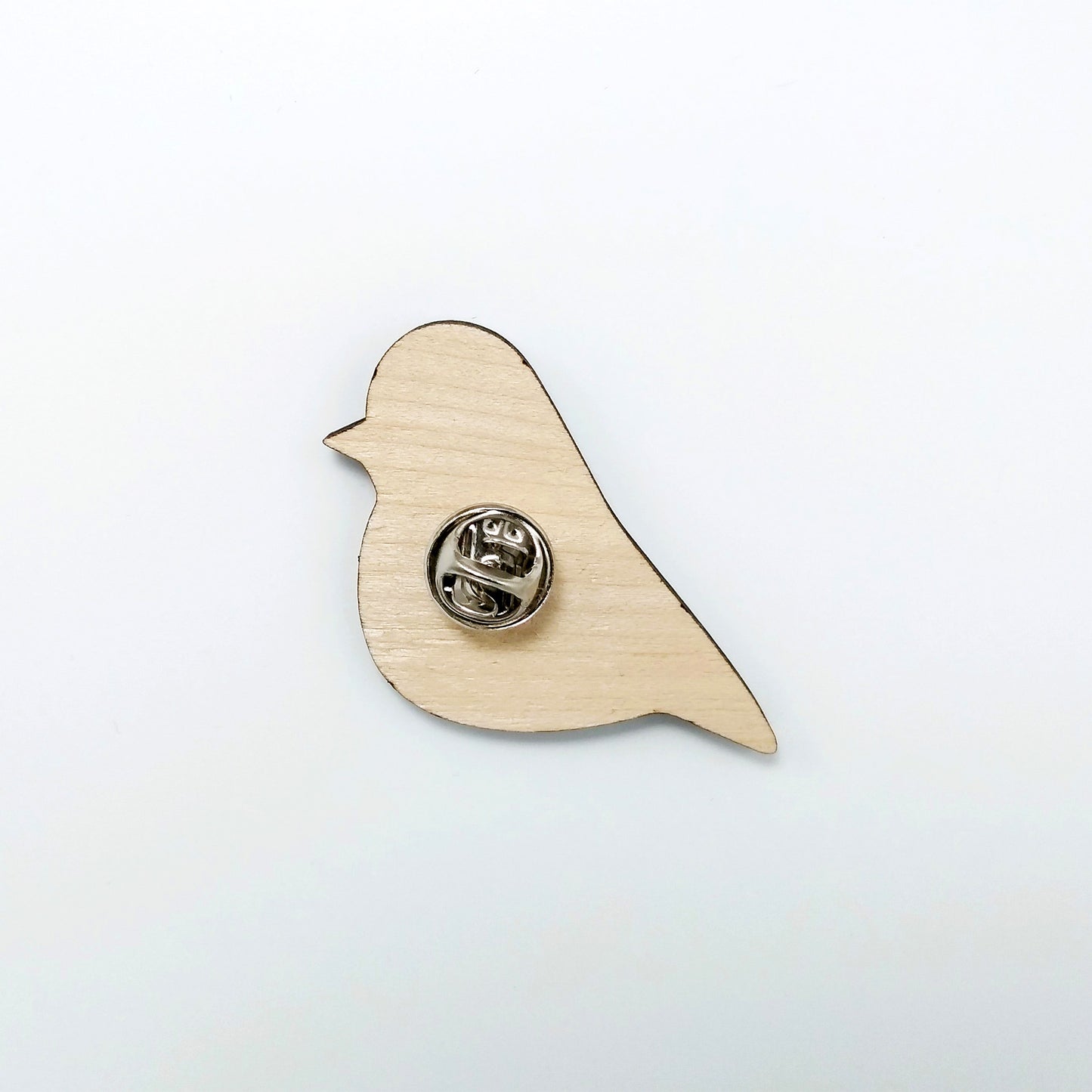 Back of robin pin badge showing metal butterfly clutch pin