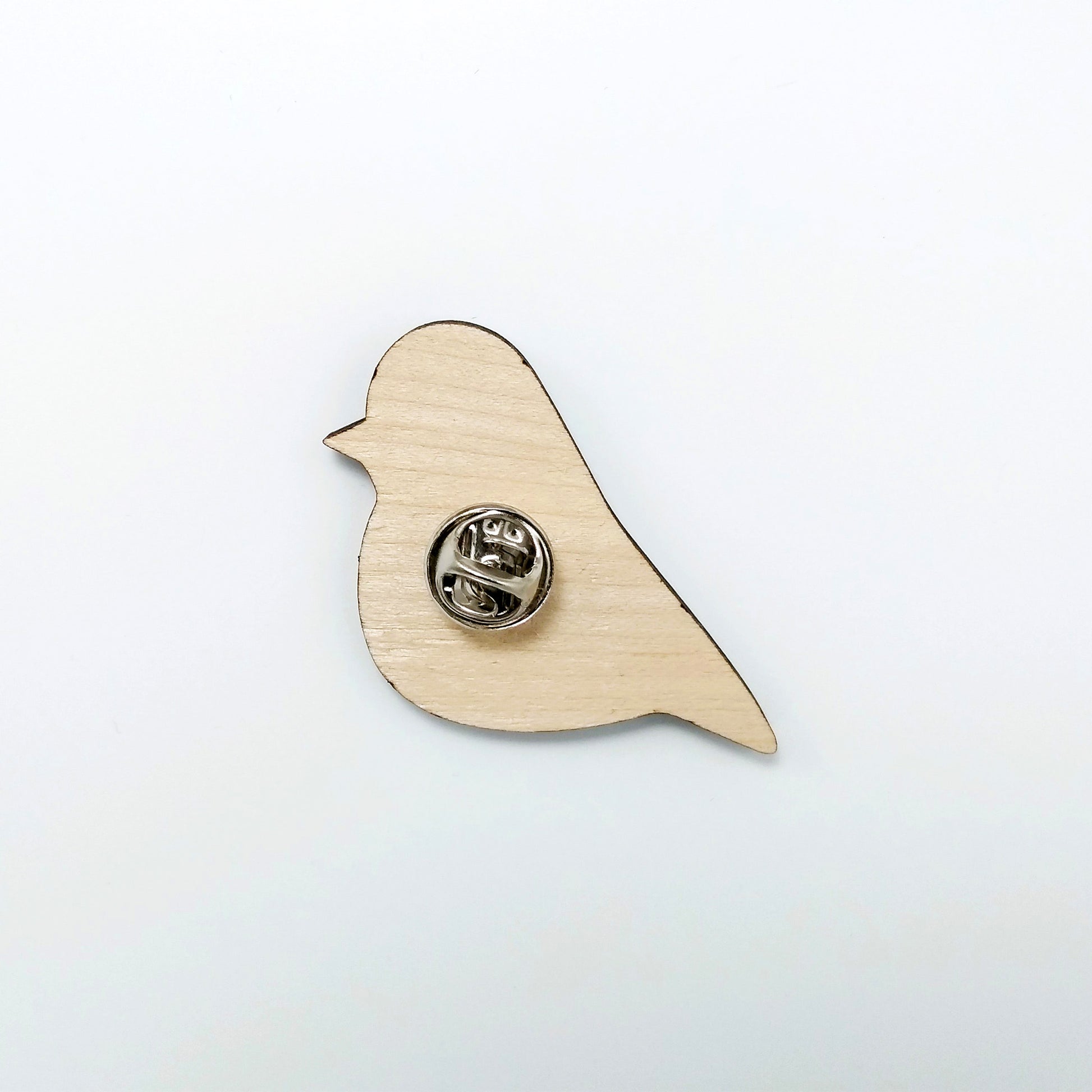 Back of robin pin badge showing metal butterfly clutch pin