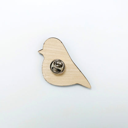Back of robin pin badge showing metal butterfly clutch pin