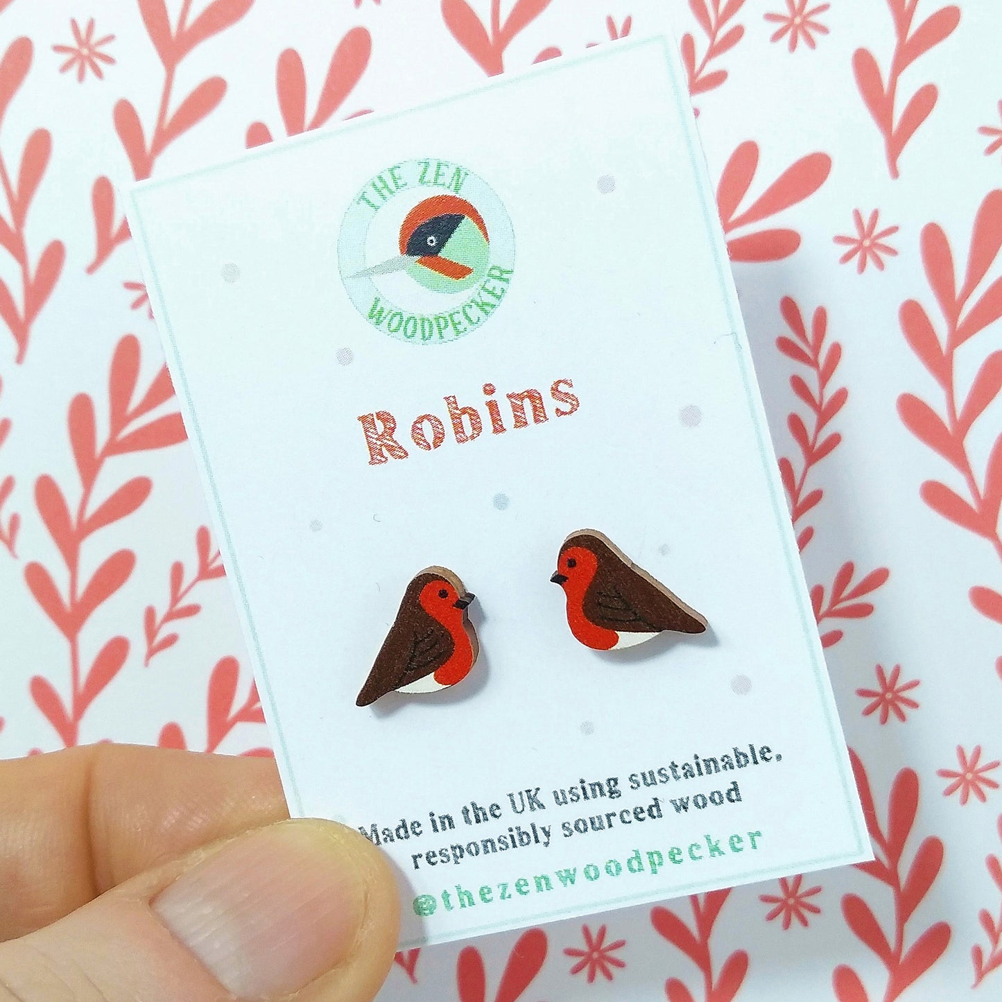 Wooden robin stud earrings on display card