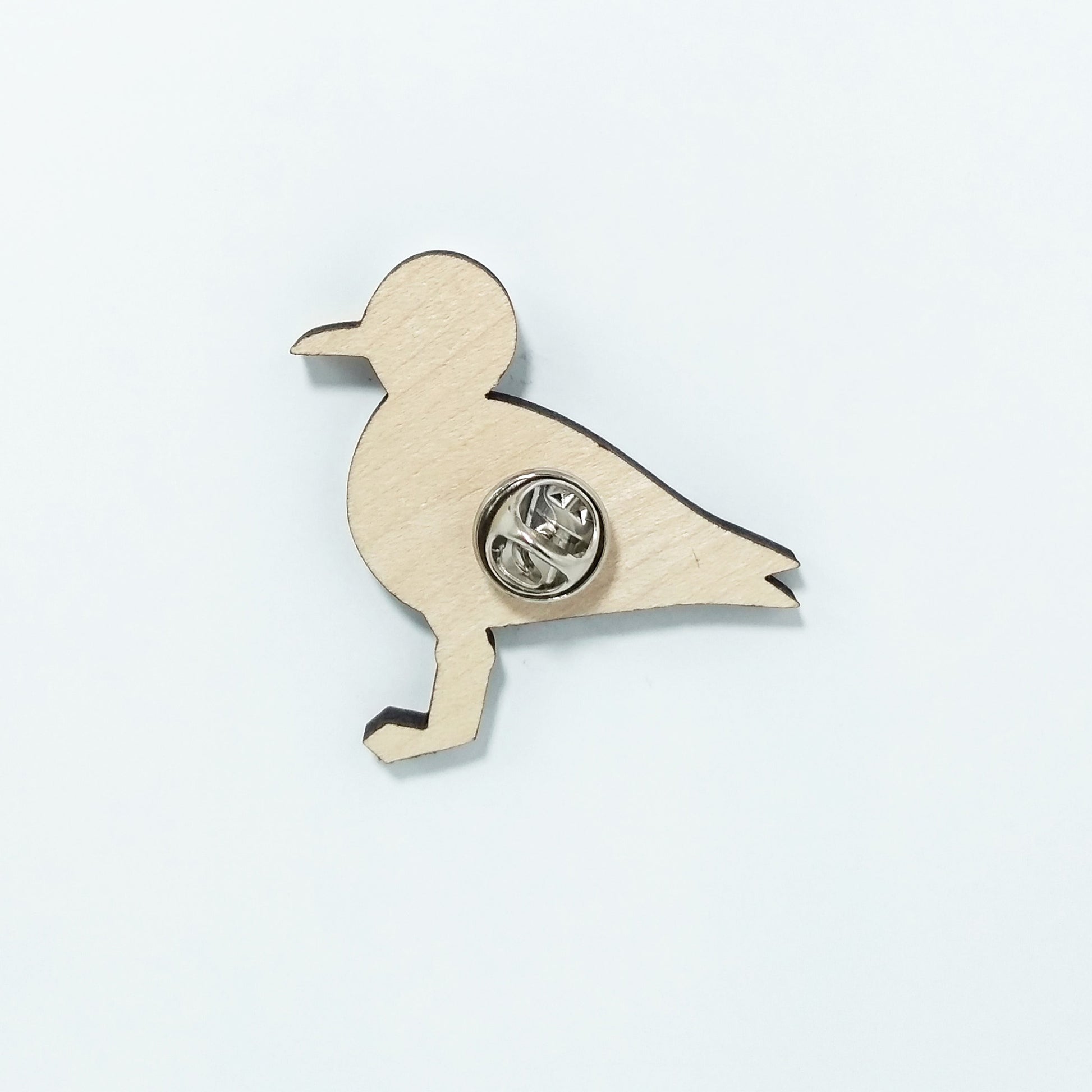 Back of seagull pin badge showing metal butterfly clutch pin