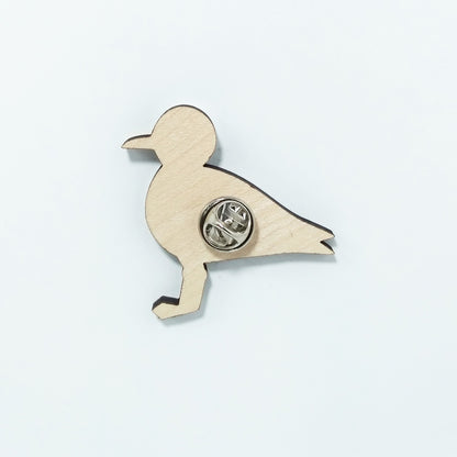 Back of seagull pin badge showing metal butterfly clutch pin