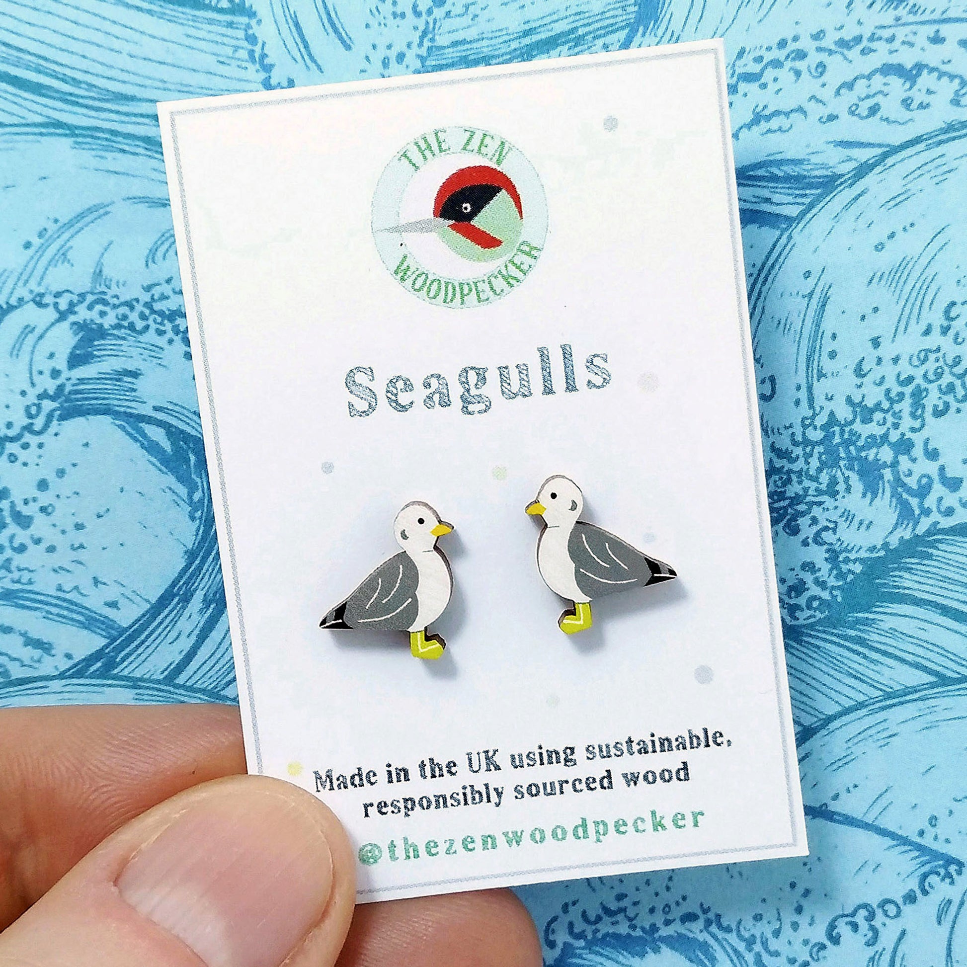 Wooden seagull stud earrings on display card