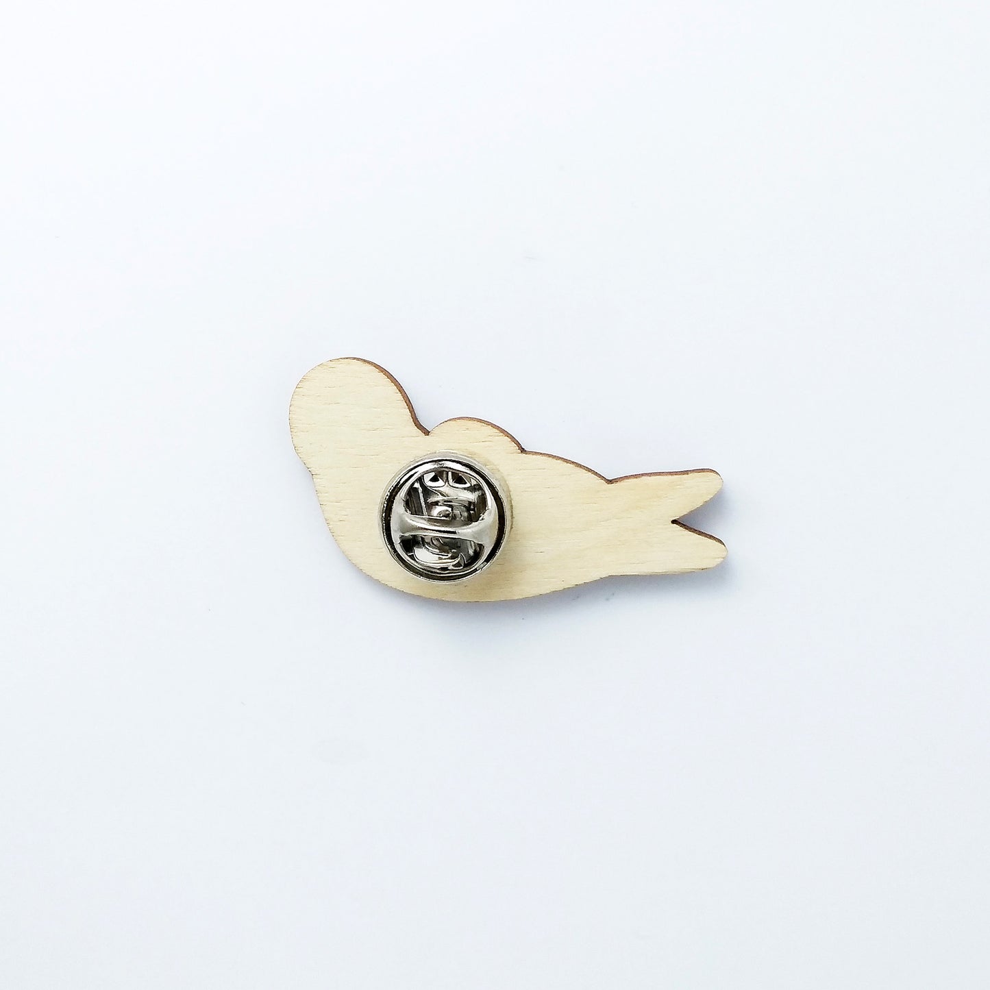 Back of seal pin badge showing metal butterfly clutch pin
