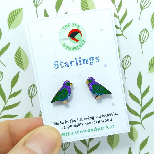 Wooden starling stud earrings on display card