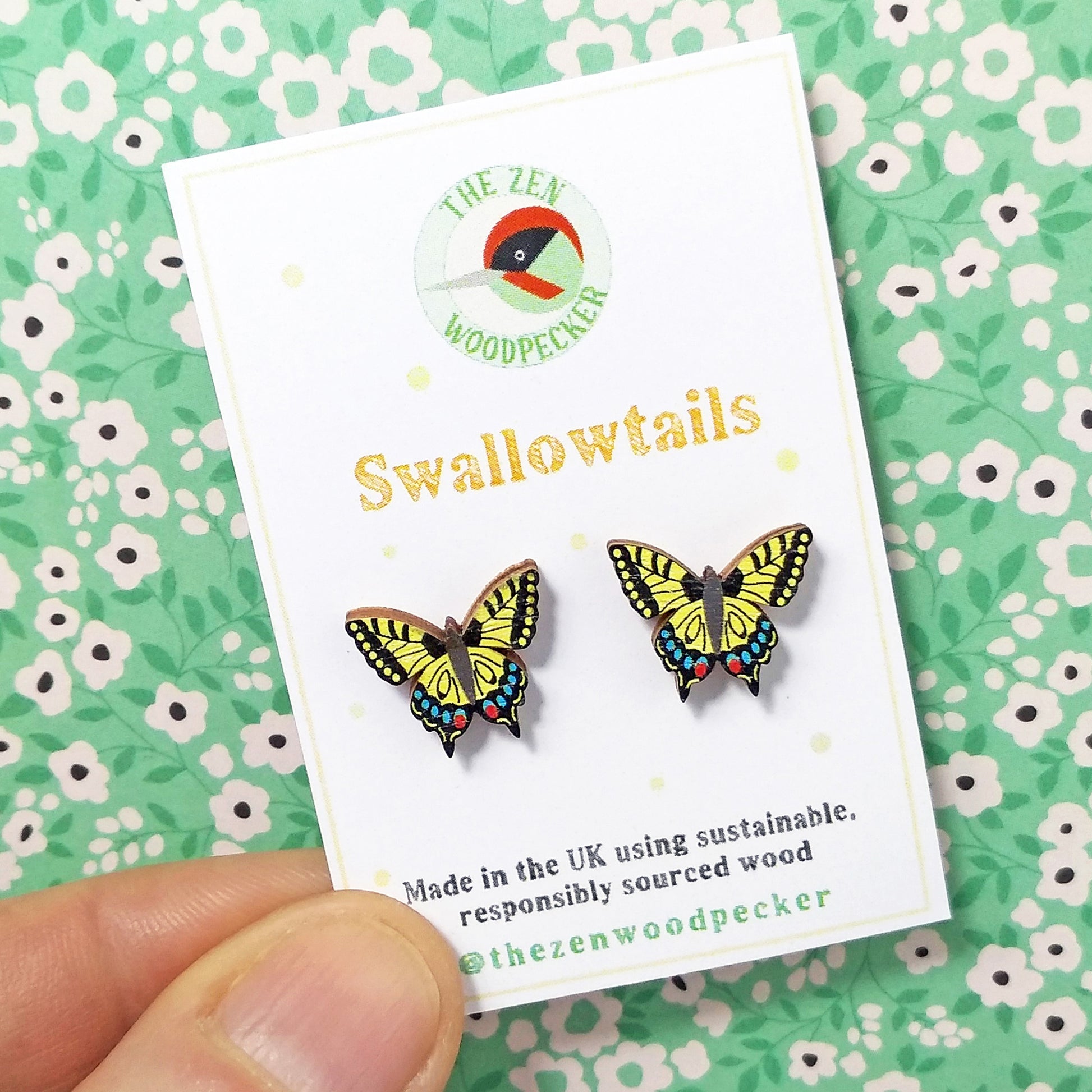Wooden swallowtail butterfly stud earrings on display card
