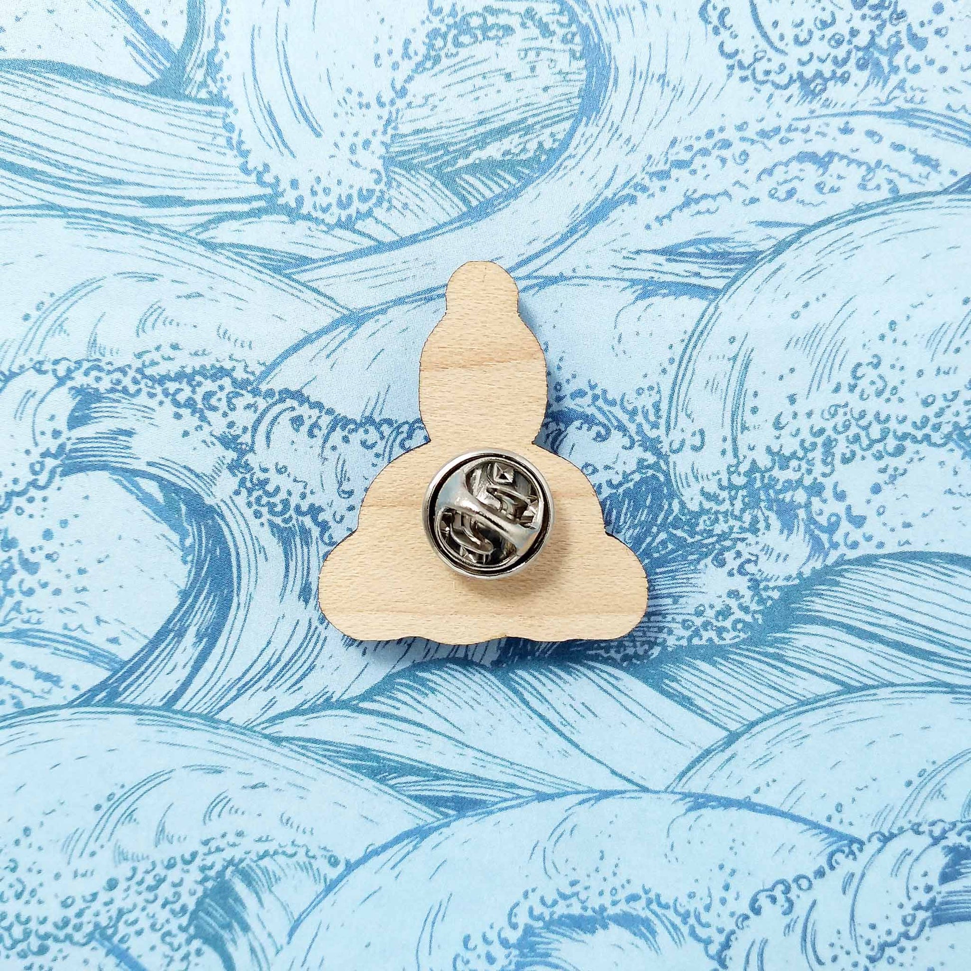 Back of wild swimmer pin badge showing metal butterfly clutch pin