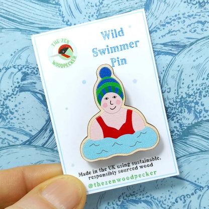 Wooden wild swimmer pin badge on display card